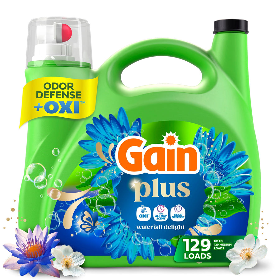 Green Gain Plus laundry detergent jug with Gain logo, floral blue label, odor defense + OXI callout and 129 loads badge