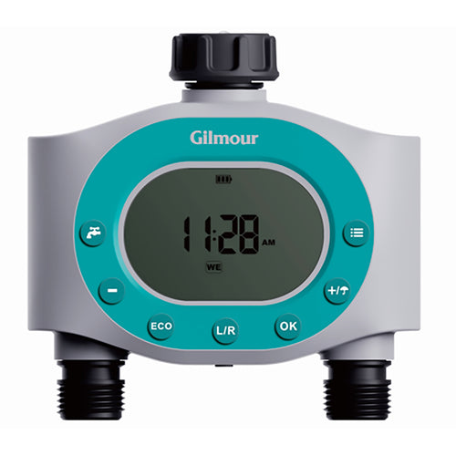 Close-up of a Gilmour single-outlet LCD hose timer with teal control ring and display