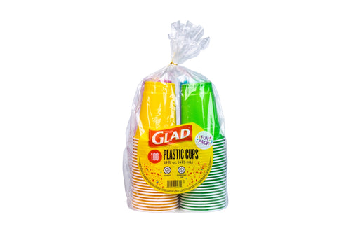 Clear bag of Glad plastic party cups with yellow label and stacked striped yellow and green cups on white background