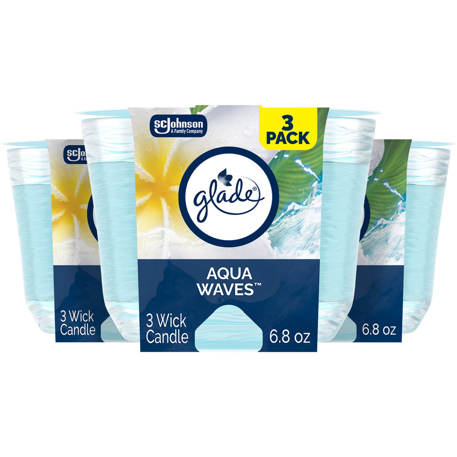 Three-pack Glade Aqua Waves 3-wick candle packaging with blue ocean-themed label and 6.8 oz callout