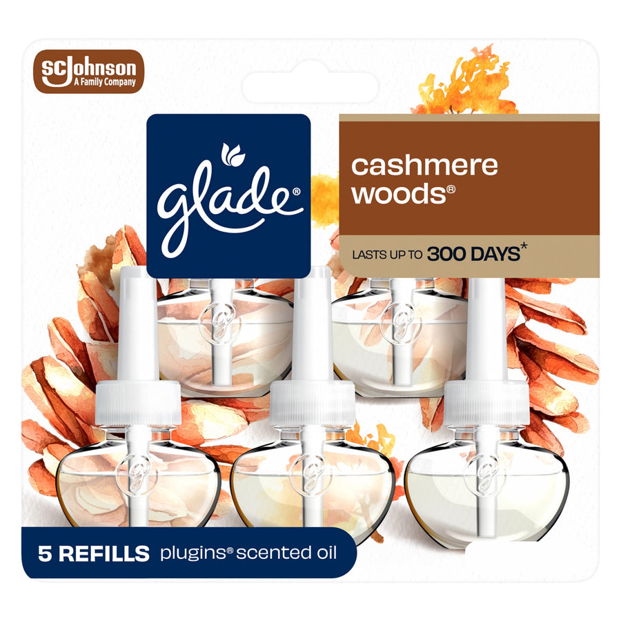 Front packaging of Glade Cashmere Woods plug-in scented oil refills showing five clear refill bottles and Glade logo.