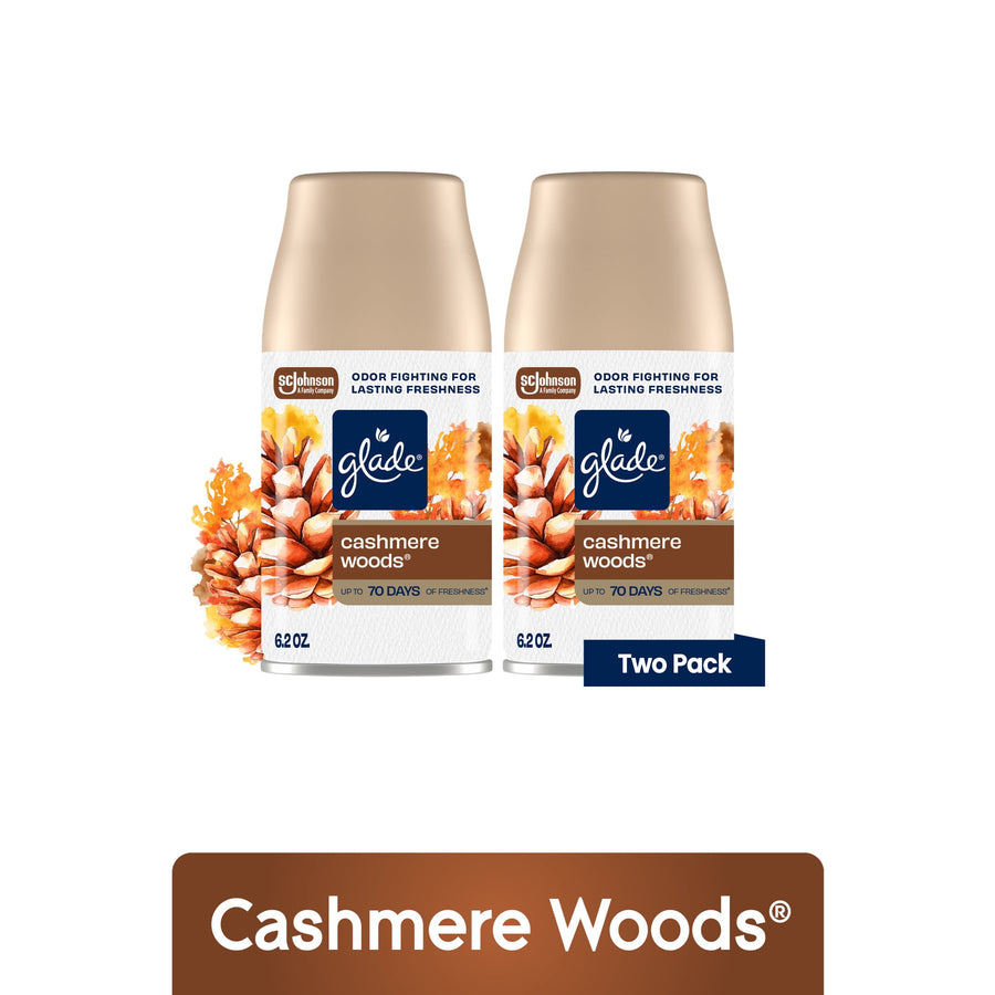 Two Glade Cashmere Woods automatic spray refill cans with floral pinecone artwork and two-pack label