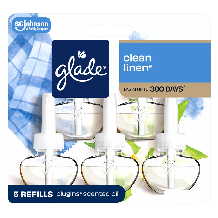 Glade branded blister pack showing five clear plug-in oil refill bottles with clean linen label and blue branding