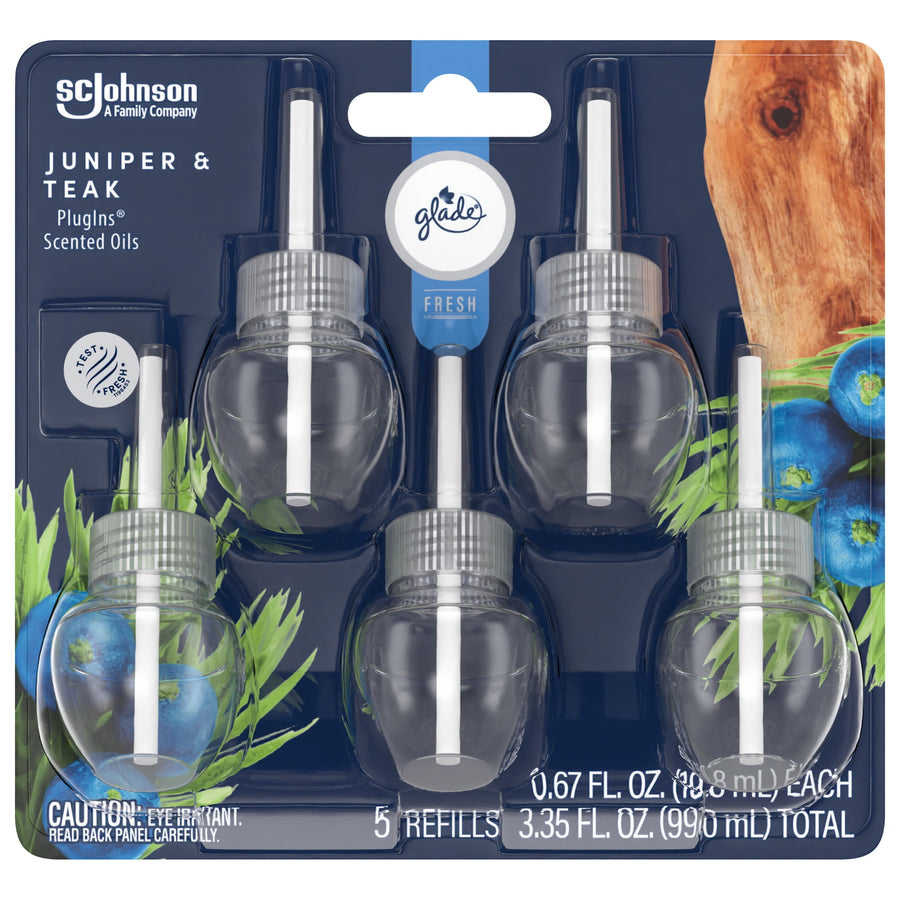 Front blister pack of Glade Juniper & Teak PlugIns scented oil refills showing five clear refill bulbs