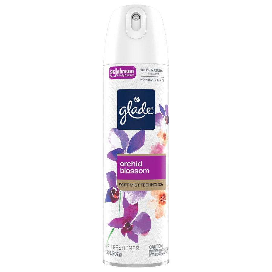 Studio product shot of a Glade Orchid Blossom soft mist aerosol can on white background showing label and floral design.