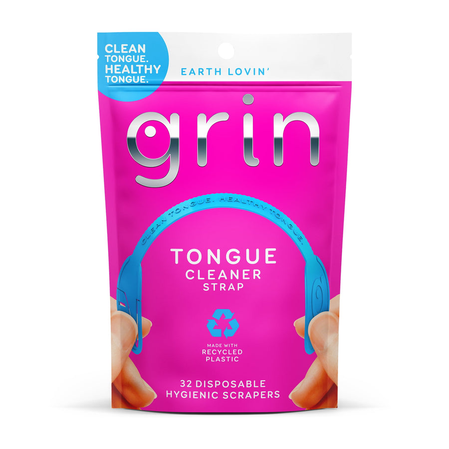 Bright pink resealable pouch of Grin Tongue Cleaner Strap showing blue strap illustration and recycled-plastic icon