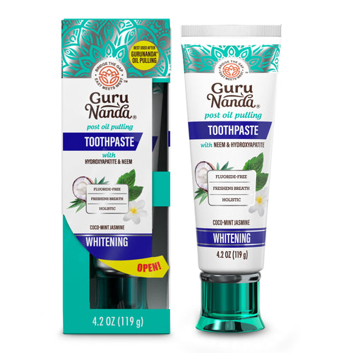 Guru Nanda whitening toothpaste tube and matching retail box shown side-by-side with teal cap and floral accents.