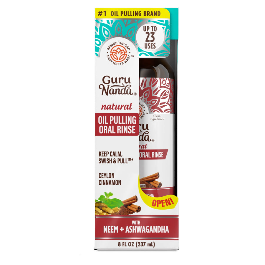 GuruNanda natural oil pulling oral rinse bottle visible through branded retail-style box with cinnamon and coconut imagery.