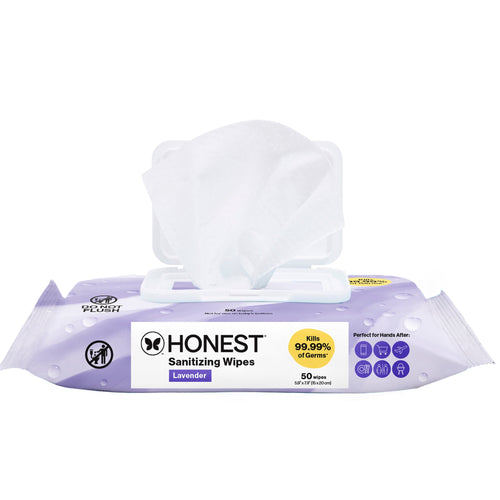 Open lavender Honest sanitizing wipes pack with a single white wipe pulled through the resealable hard lid