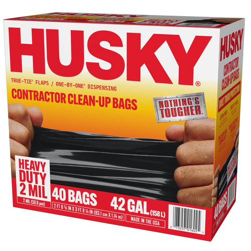 Three-quarter view of Husky contractor clean-up bags retail box showing logo, hands stretching a black bag and product callouts