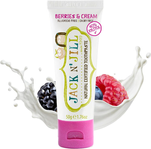 Tube of Jack N' Jill Berries & Cream toothpaste with fruit and milk splash background