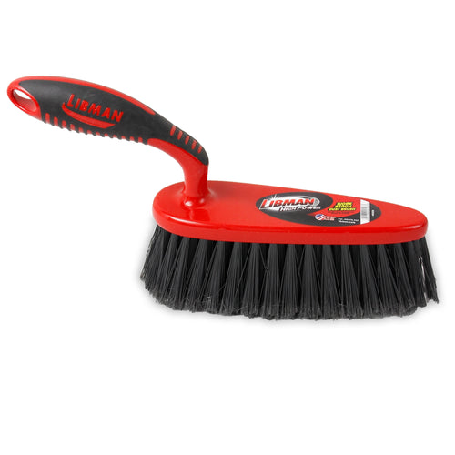 Red and black Libman workbench dust brush on white background showing dense black bristles and contoured handle.