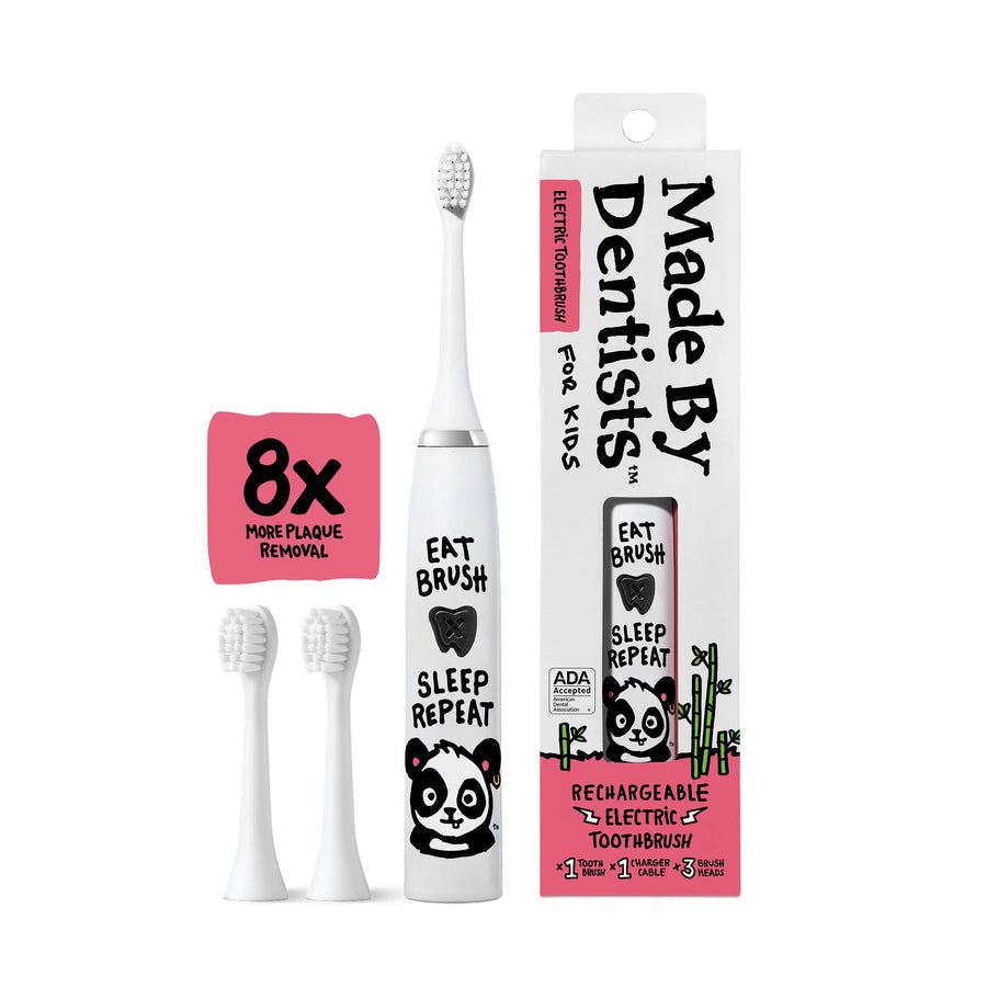 White kids electric toothbrush with panda graphic, two extra white brush heads and boxed packaging on white background