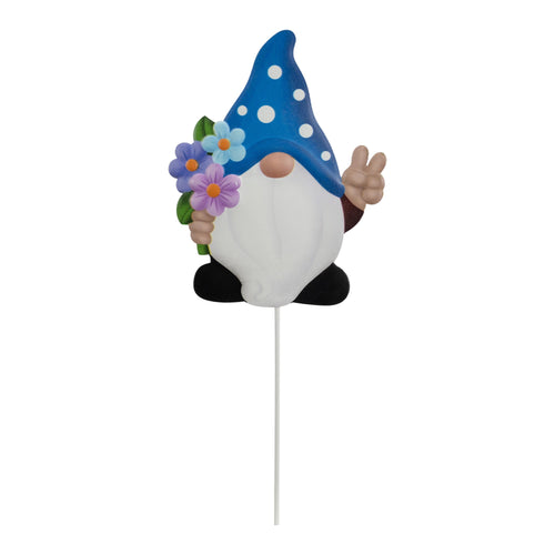 Metal garden gnome stake with blue polka-dot hat holding purple flowers on white stake