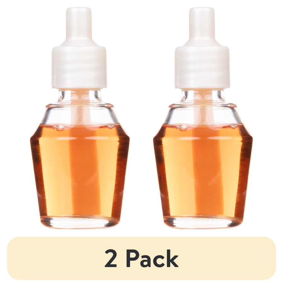 Two small clear refill bottles of amber fragrance oil with white caps labeled as a 2 pack