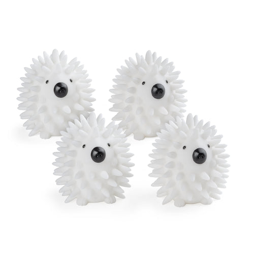 Four white hedgehog‑style spiky plastic dryer balls with black noses arranged on a white background