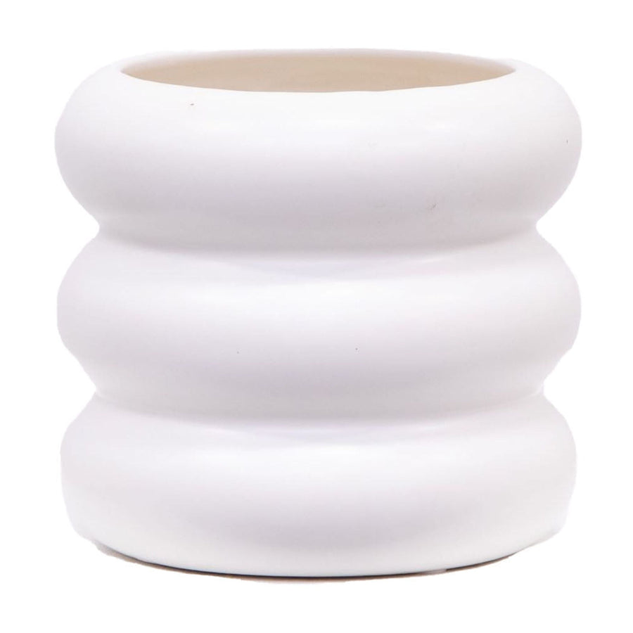 Close-up of a white ceramic planter with three rounded bubble tiers and a smooth matte finish.