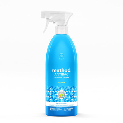 Bright blue Method Antibac spearmint bathroom cleaner spray bottle with white trigger on a white background