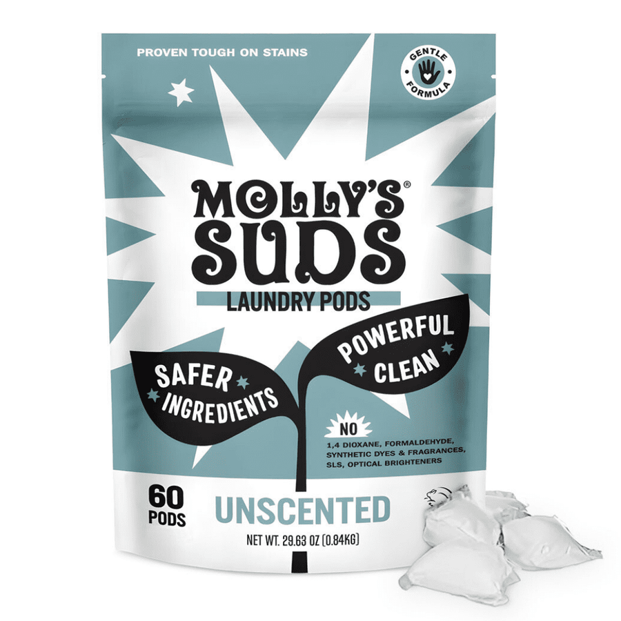 Front-facing pouch of Molly's Suds unscented laundry pods with three pods placed beside the bag