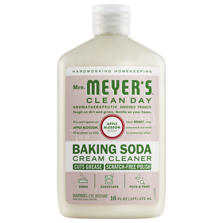 Front-facing bottle of Mrs. Meyer’s Baking Soda Cream Cleaner with apple blossom label on white background