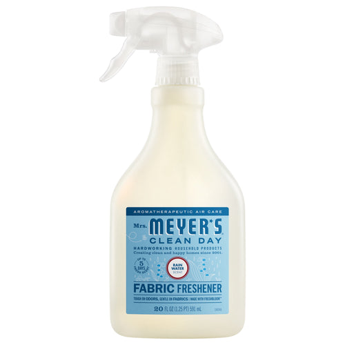 Spray bottle of Mrs. Meyer’s Clean Day Fabric Freshener with blue Rain Water label on white background.