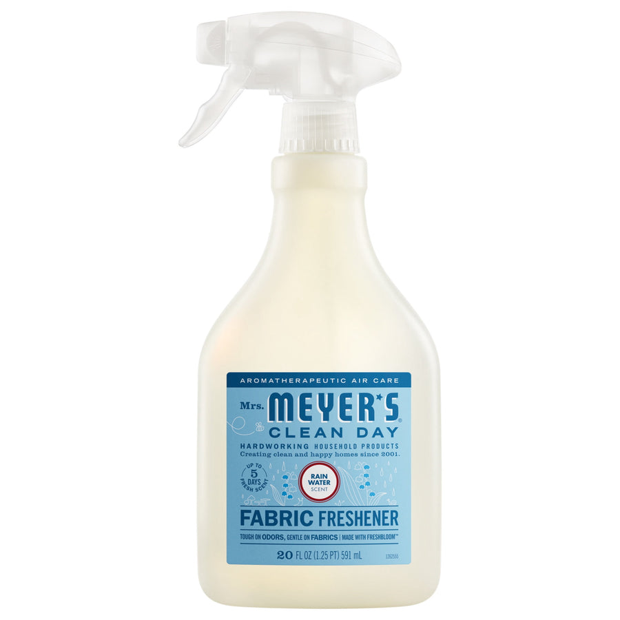 Spray bottle of Mrs. Meyer’s Clean Day Fabric Freshener with blue Rain Water label on white background.