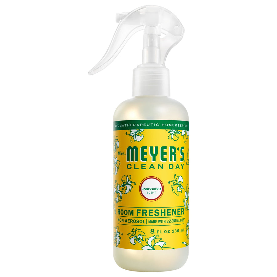 Mrs. Meyer’s Clean Day honeysuckle room freshener bottle with yellow floral label and clear trigger sprayer