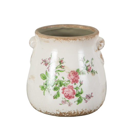 White distressed ceramic planter with pink rose floral decal and small scroll handles, studio isolated on white.