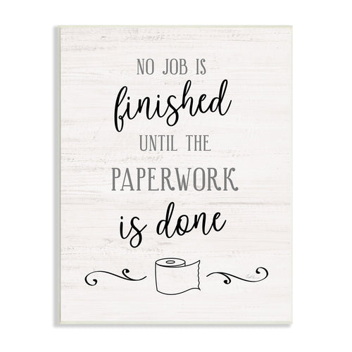 Light wood-textured wall plaque reading “No job is finished until the paperwork is done” with a small toilet-paper roll illustration