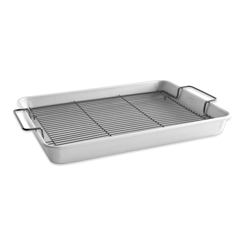 Aluminum roasting pan with black nonstick crisping rack and side handles on white background