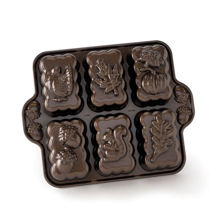 Nordic Ware harvest-themed mini loaf pan with six detailed cavity designs including turkey, leaf and pumpkin
