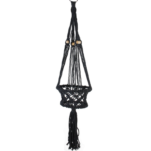 Black macramé hanging planter with tassel and wooden beads on white background, full-length view