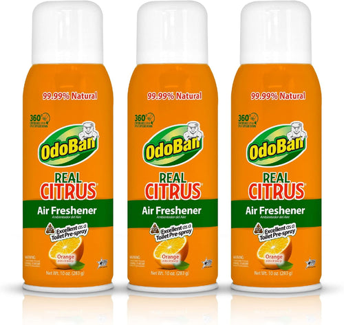 Three OdoBan Real Citrus orange aerosol air freshener cans with white caps on white background
