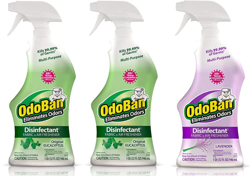 Three OdoBan disinfectant spray bottles side-by-side: two eucalyptus (green) and one lavender (purple) on a white background.