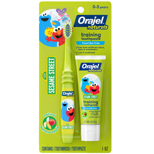 Green blister pack showing Orajel Naturals Sesame Street training toothpaste tube and matching green toddler toothbrush with Elmo art