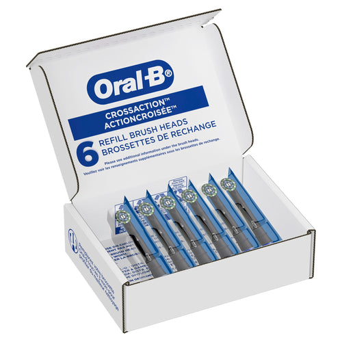 Open box of Oral‑B CrossAction refill brush heads showing six individually sealed replacement heads inside.