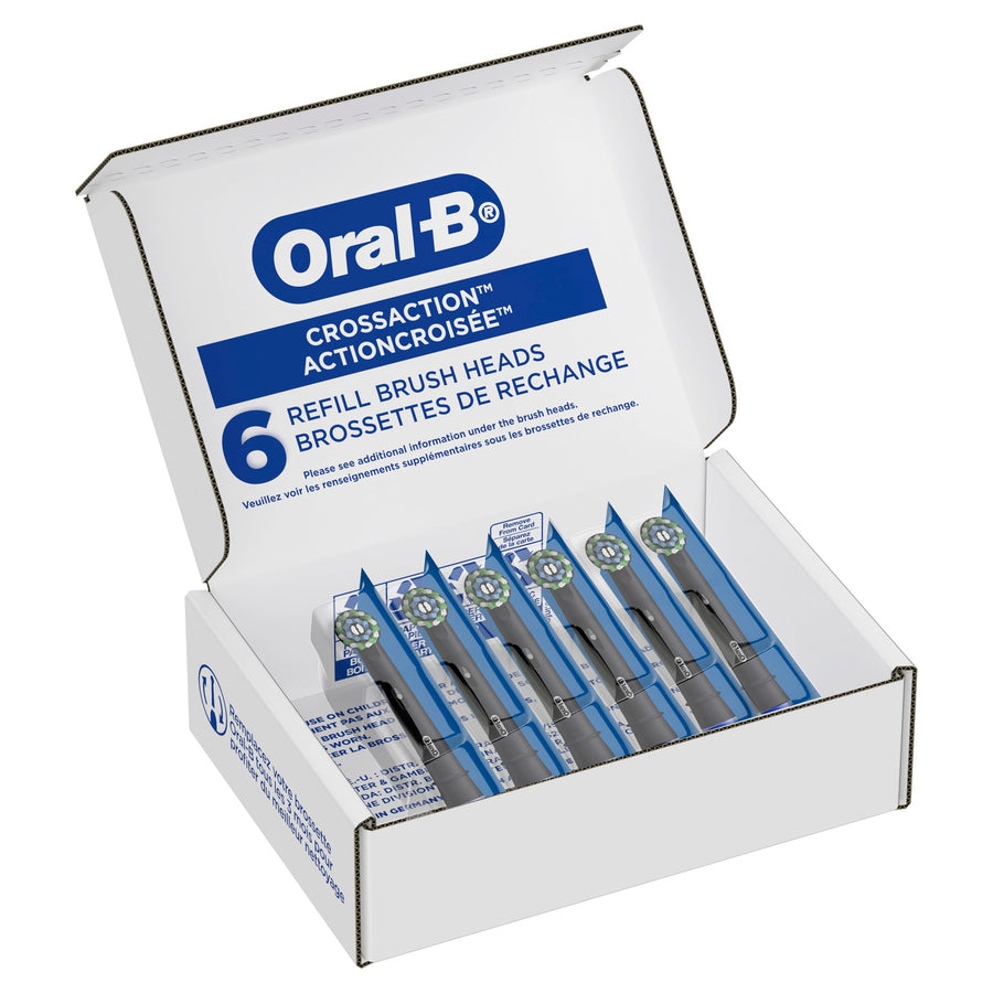 Open box of Oral‑B CrossAction refill brush heads showing six individually sealed replacement heads inside.