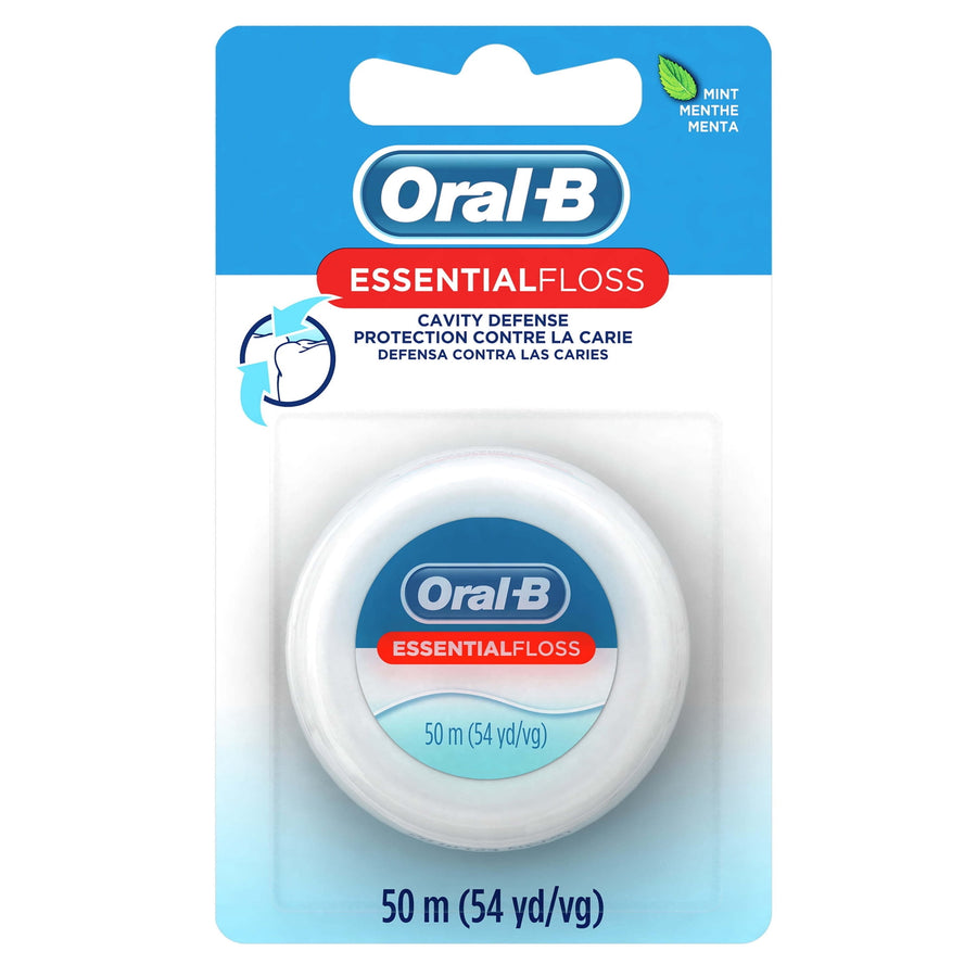 Oral‑B EssentialFloss mint waxed dental floss in blister pack showing front label and spool