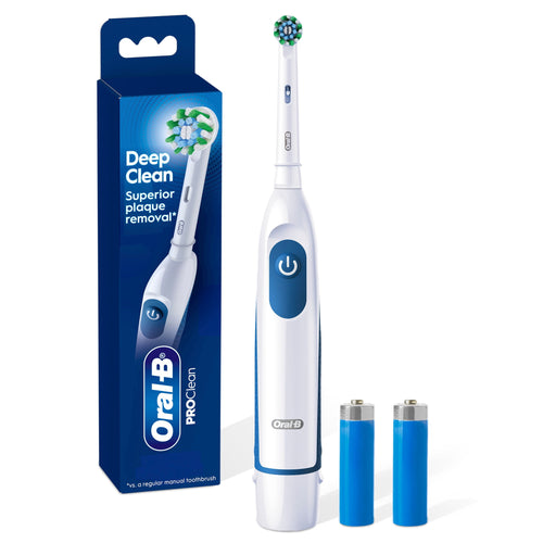 White Oral‑B Pro 100 battery toothbrush next to its blue product box and two AA batteries on a white background.