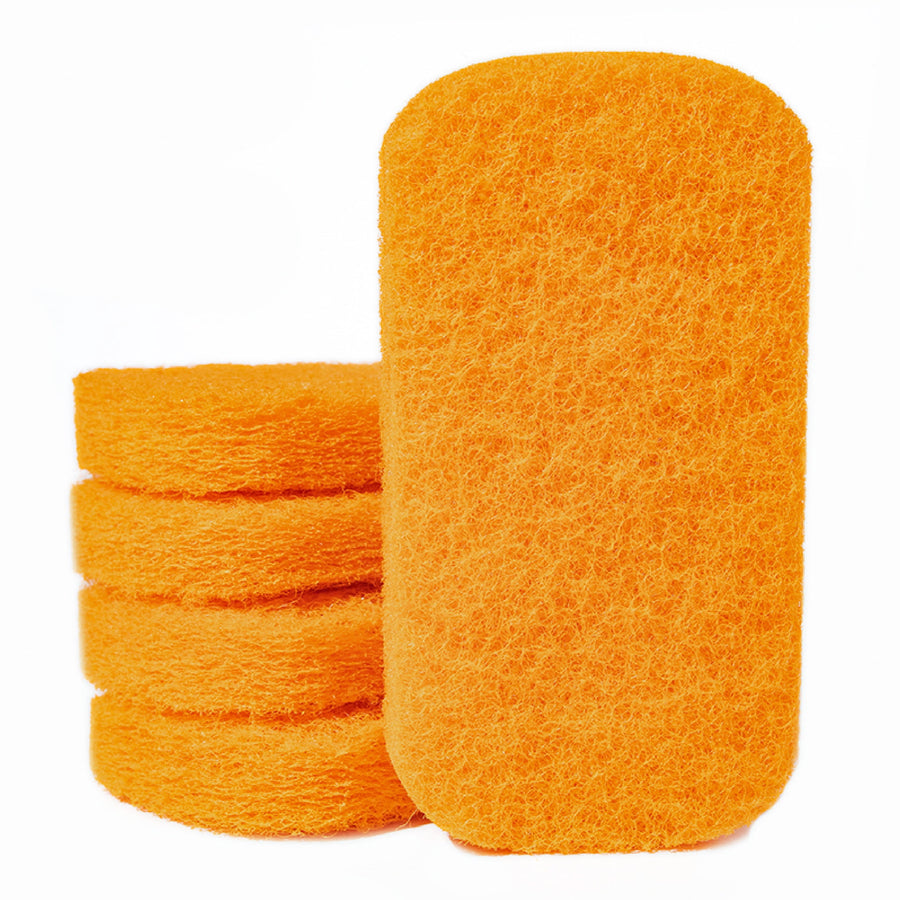 Close-up of a stack of bright orange rectangular scouring pads with rounded corners on white background.
