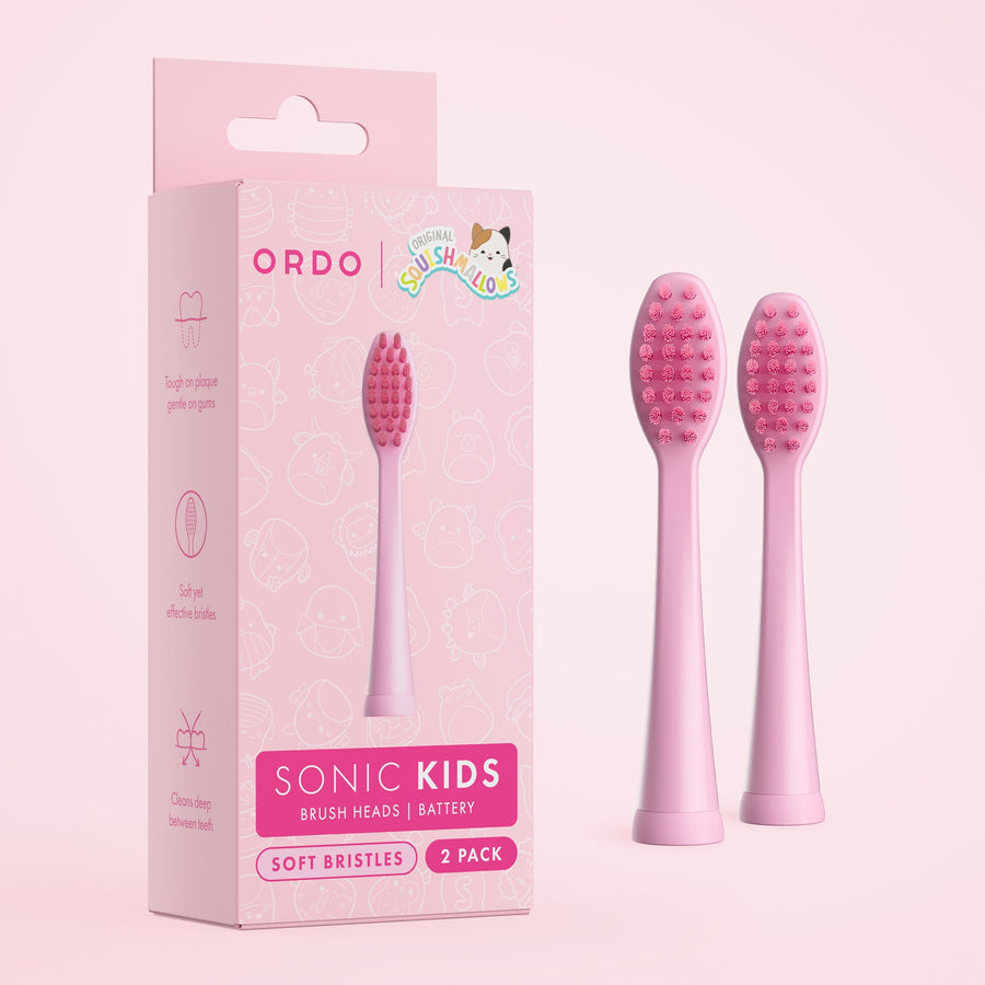 Pink Ordo Sonic Kids replacement brush heads packaging shown next to two slim pink brush heads on a pastel background.