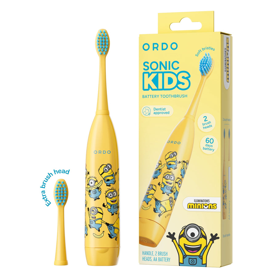 Yellow Ordo Sonic Kids battery toothbrush with Minions print, extra brush head and packaged box shown on white background.