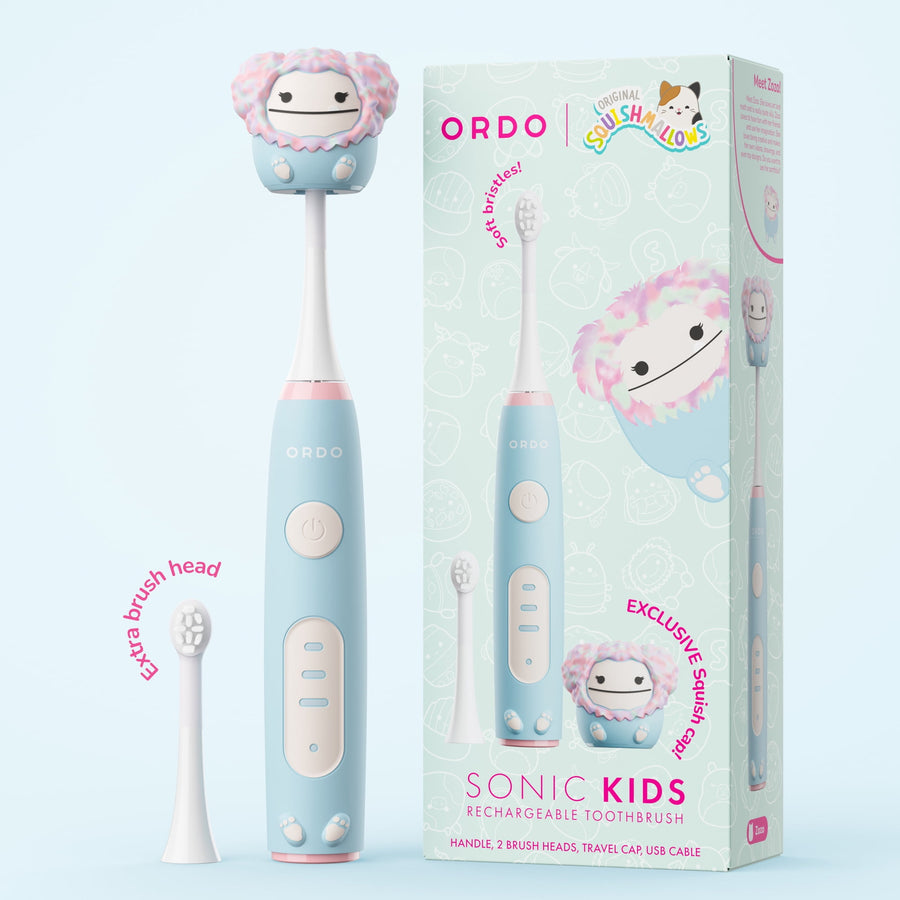 Ordo Sonic Kids rechargeable toothbrush in pastel blue with Squishmallows Zozo themed squish cap and retail box packaging.
