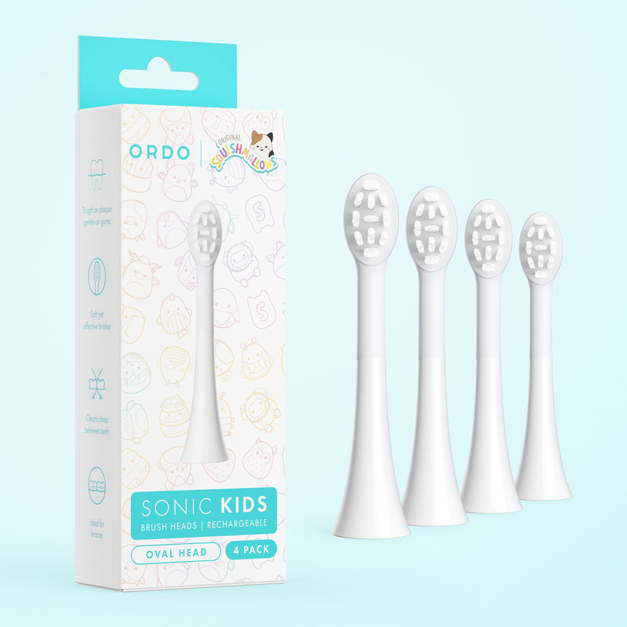 Four white oval sonic toothbrush heads beside Ordo branded product box on pale blue background