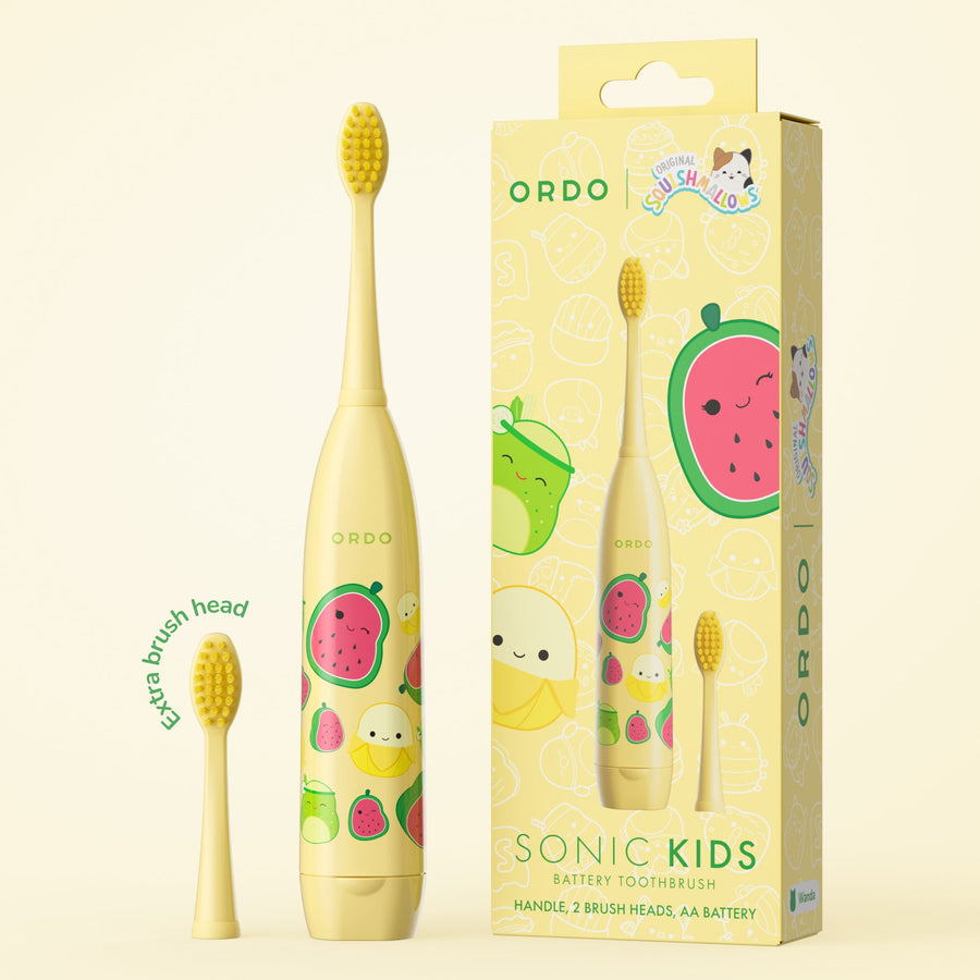 Yellow Ordo kids sonic toothbrush with fruit-themed Squishmallows characters and boxed packaging