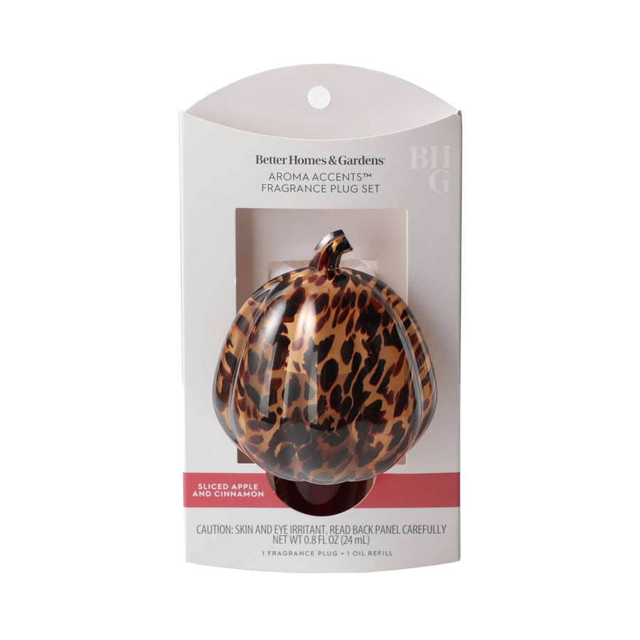 Packaged tortoiseshell pumpkin fragrance plug set visible through retail blister packaging with branding at top