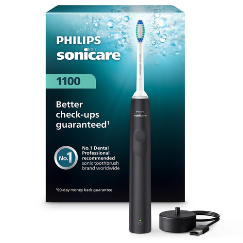 Philips Sonicare 1100 electric toothbrush in black shown with brush head, USB charging base and branded teal packaging in background.