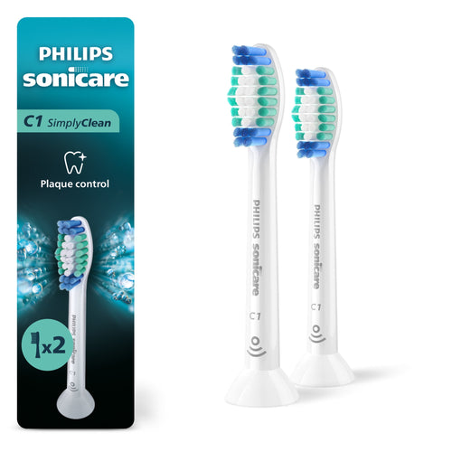 Two white Philips Sonicare C1 replacement brush heads shown next to branded teal and black retail packaging with 1x2 badge