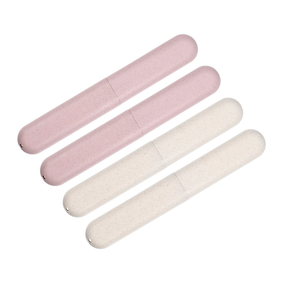 Four slim rounded toothbrush travel cases in two beige and two pink speckled plastic cylinders on white background.