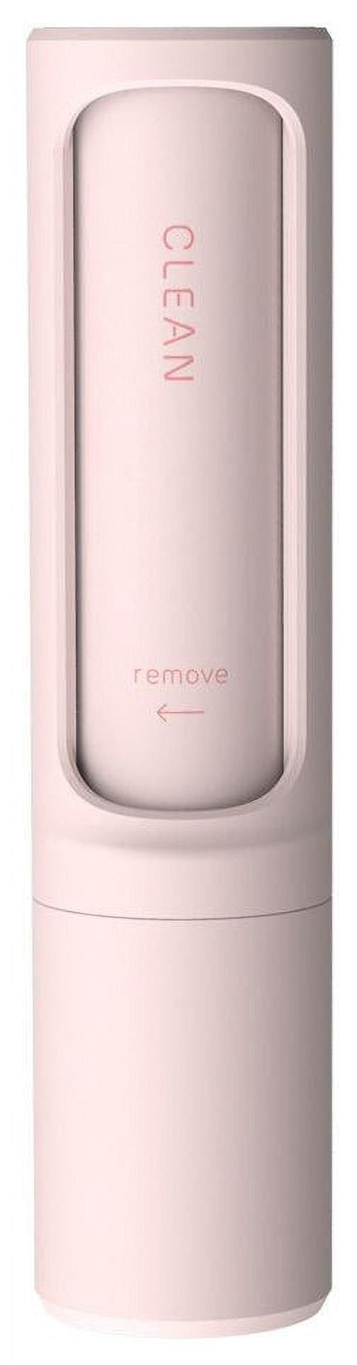 pink handheld lint remover with sliding cover labeled clean and an arrow marked remove